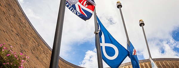 Flags (Treaty 6, Metis, Alberta and Municipal) half mast out front of St. Albert Place