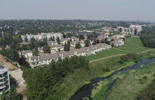 Rowhouses and apartments lining the river valley