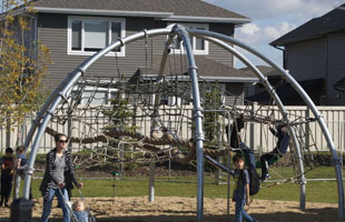 A family plays at a playground