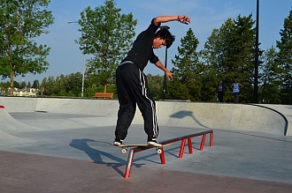Skater rides a rail at Woodlands Skatepark in Saint Albert, Alberta