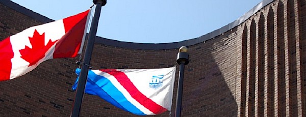 Flag poles outside city hall.