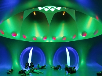 Patrons laying on the ground of a nod in a Luminarium