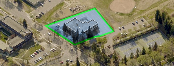 Aerial view of the 13 Mission Building with a green perimetre around the site.