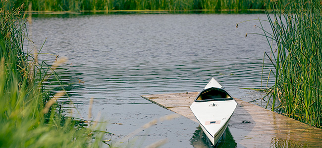Kayak sitting at a boat launch on the Sturgeon River
