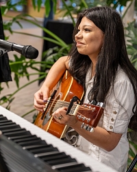 Guitarist playing and smiling
