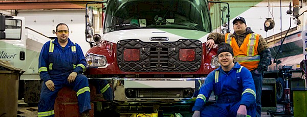 A Public Works crew conducting maintenance work on a Fire Services vehicle.