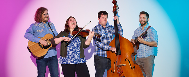 Michelle and Friends holding instruments