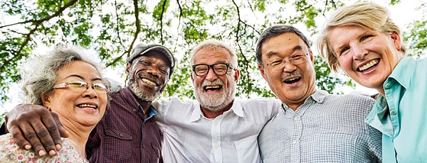 Group of five seniors with arms around each other