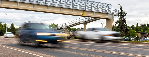 Photo of blurred out vehicles driving down St. Albert Trail.