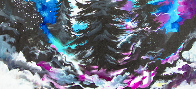 Black pine trees in front of a colourful sky