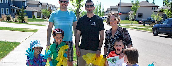 Families smiling with bags
