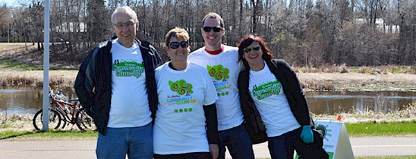 Photo of four adults volunteering at Spruce Up