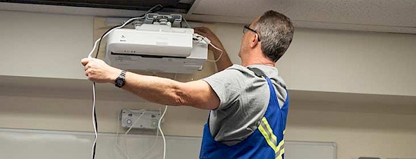Public Works staff fixing equipment