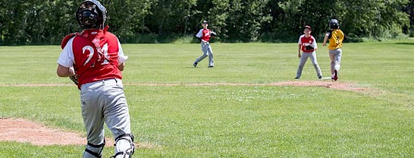 Baseball game being played at baseball diamond