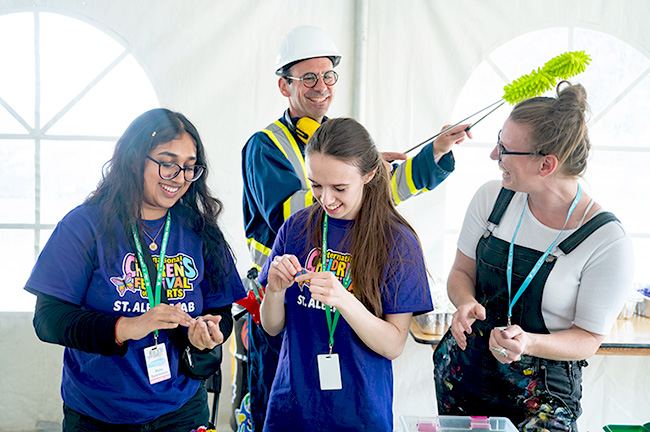 4 volunteers laughing