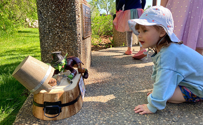 Child looking at toad