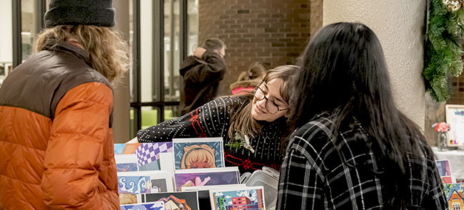 Youth showcasing artwork