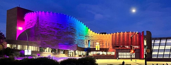 St. Albert Place illumniated by a rainbow of colours at night