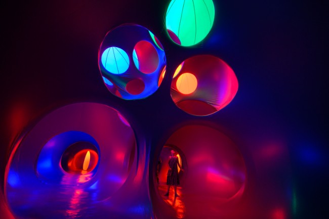 a guest explores an interactive art installation