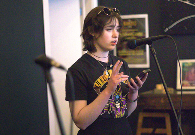 Girl in room talking into a mic