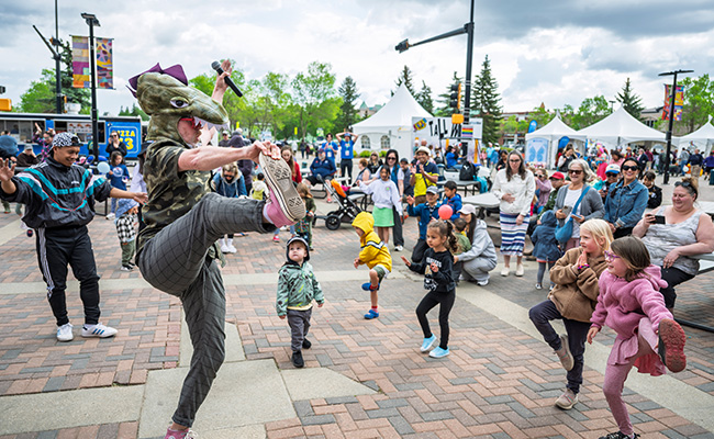 Performer chancing in a dinosaur costume