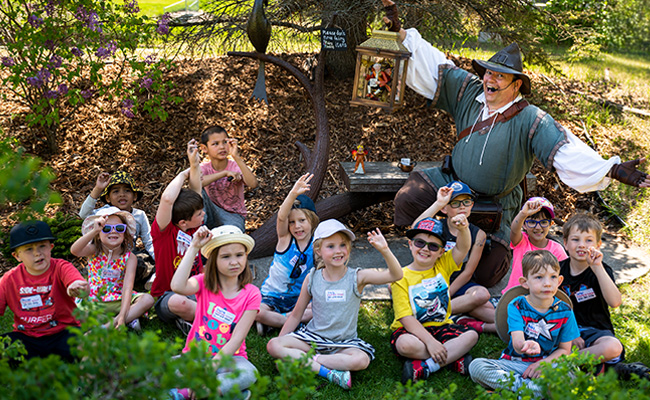 Fizzlewit in a forest with many children