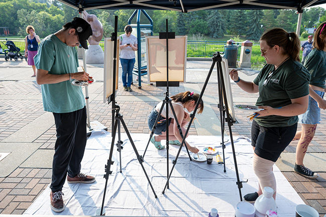 Two artists involved in a live art battle