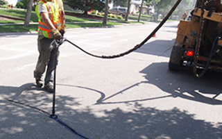 Filling a crack in the road